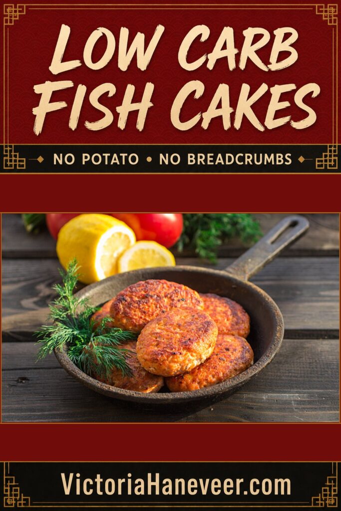 Keto fish cakes in a cast iron skillet with lemon and tomatoes in the background.