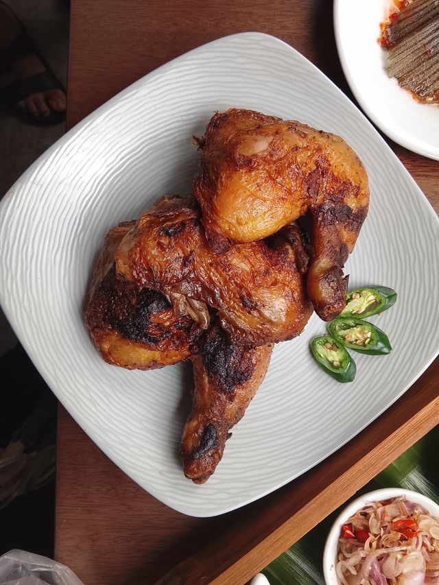 Baked chicken thighs on a plate.