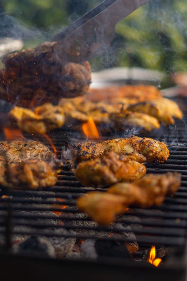 Chicken thighs on a hot grill.