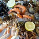 Traditional fruits de mer platter including seafood delicacies like lobster, shrimp, clams, oysters, whelks and winkles