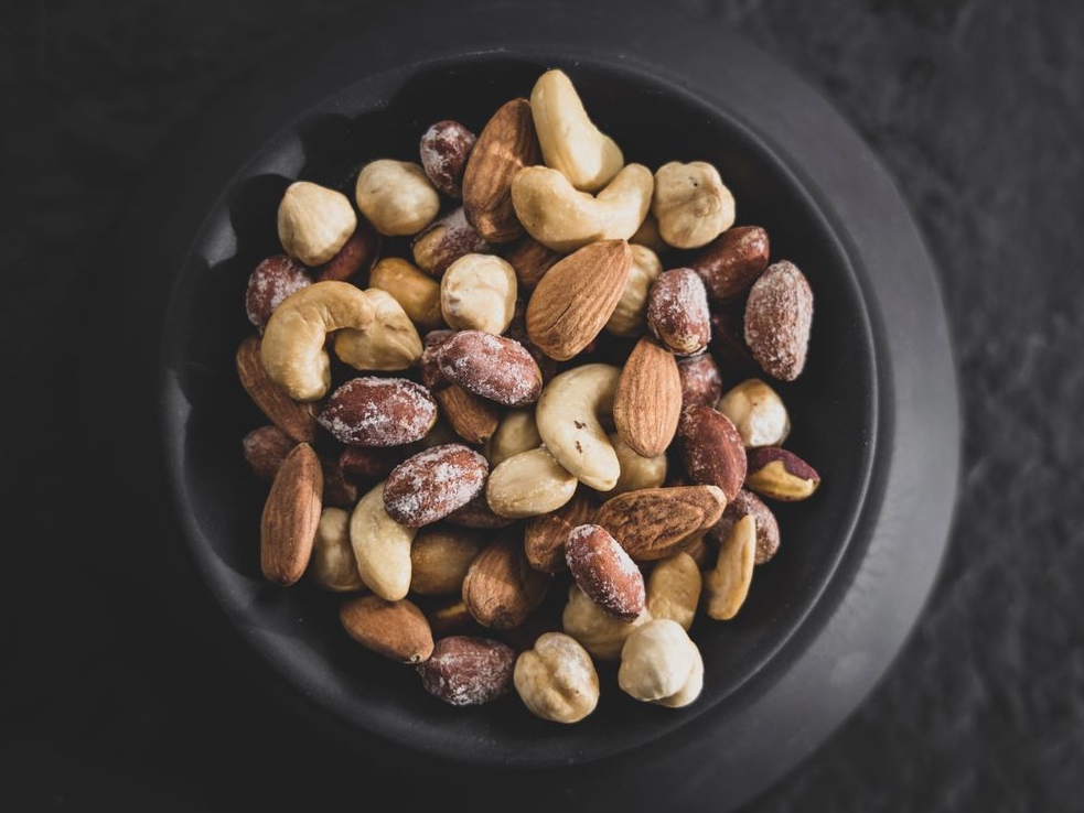 A bowl of smoked nuts.
