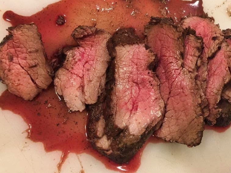 Juicy sliced tri-tip cooked to medium rare. One of the best outdoor or indoor smoker recipes.