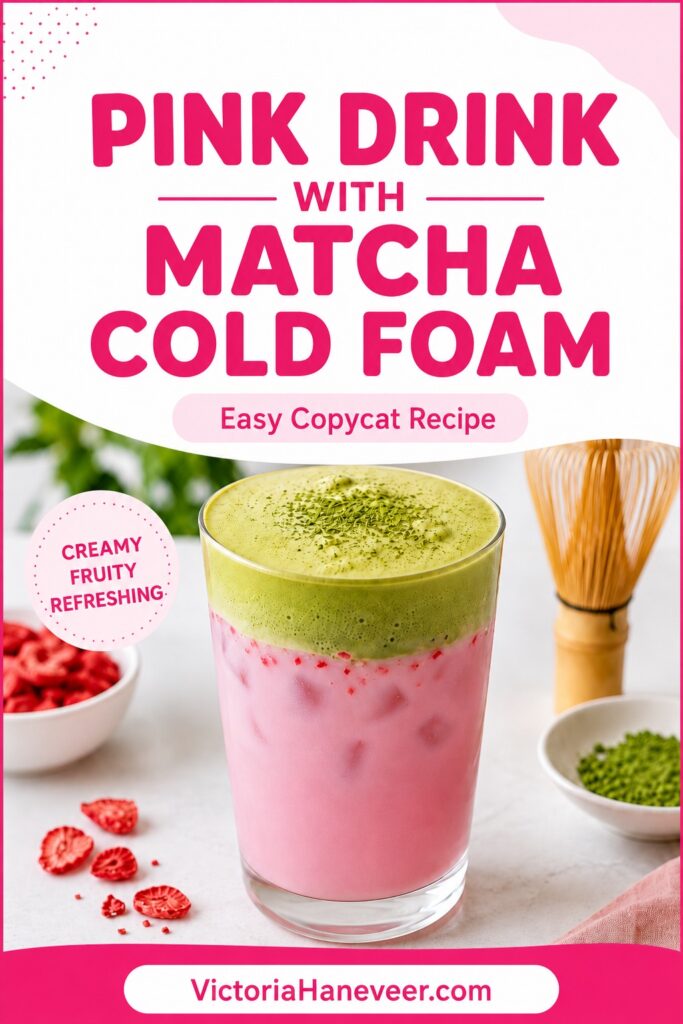 A glass of pink drink topped with green matcha cold foam.