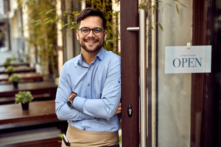 Happy man running own business