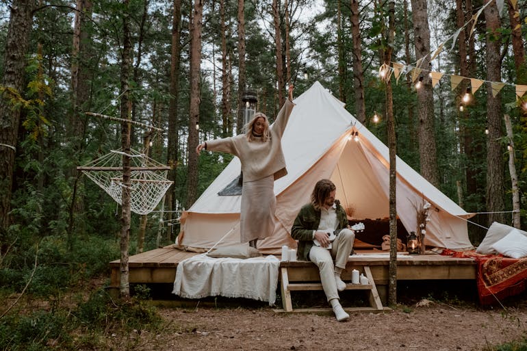 a couple having fun while glamping