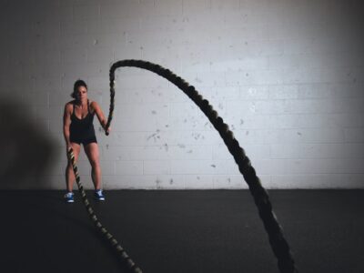 A woman holding exercise ropes, a way of crushing your exercise goals