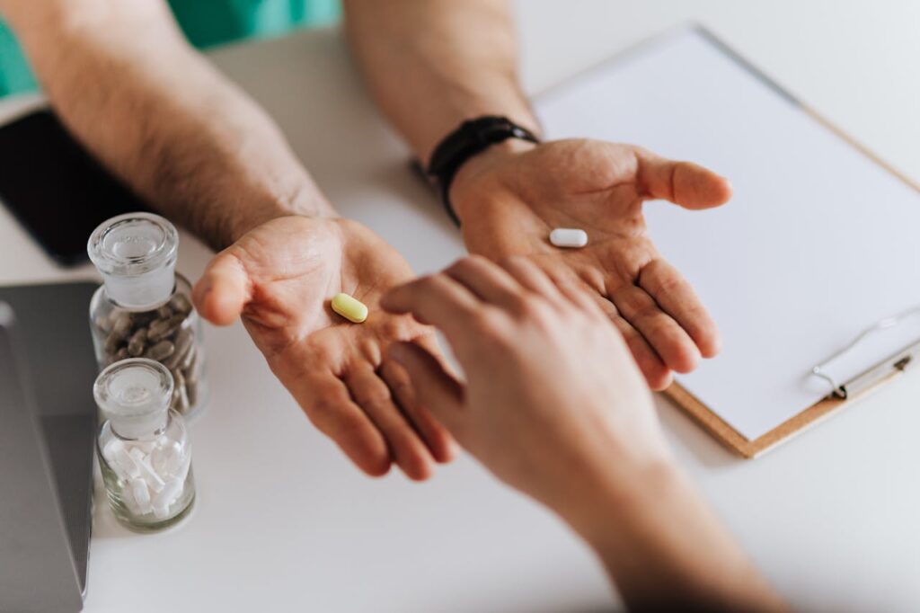 giving tablets to a man