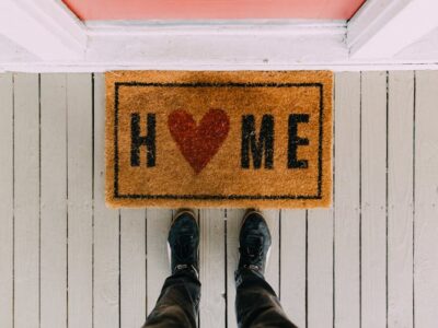 Front door mat with word Home and a heart instead of the letter O