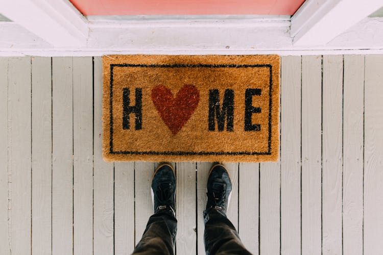 Front door mat with word Home and a heart instead of the letter O