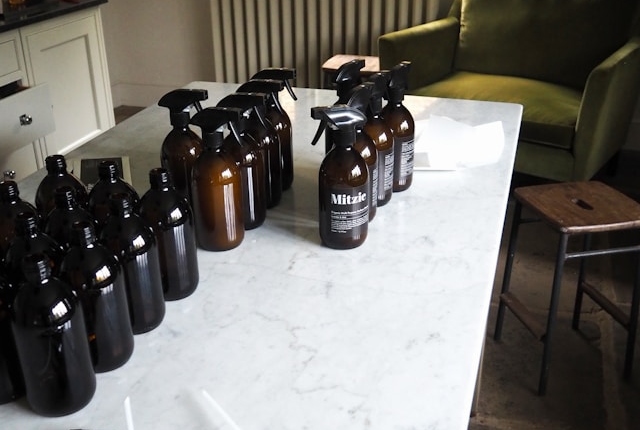 Spray bottles on a white surface