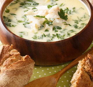 Cullen skink soup in a wooden serving bowl