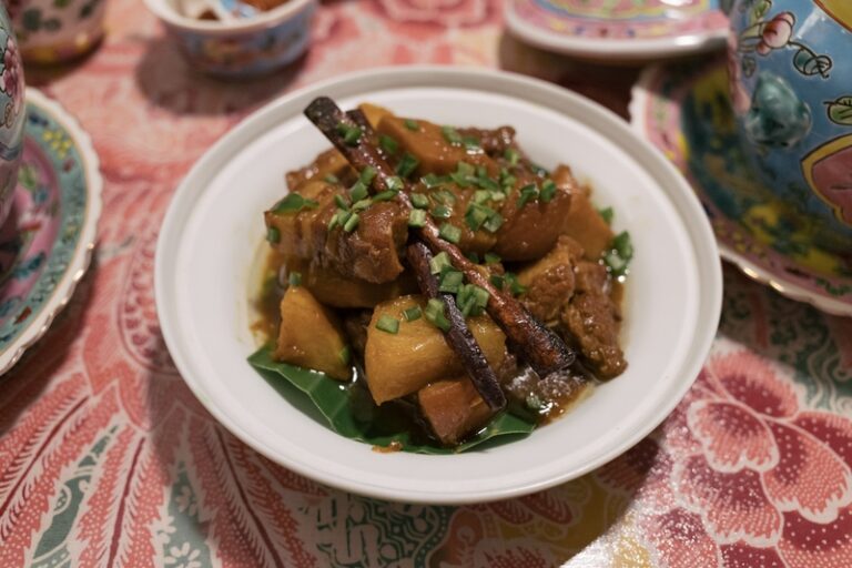Bowl of babi pongteh with braised pork and potatoes.