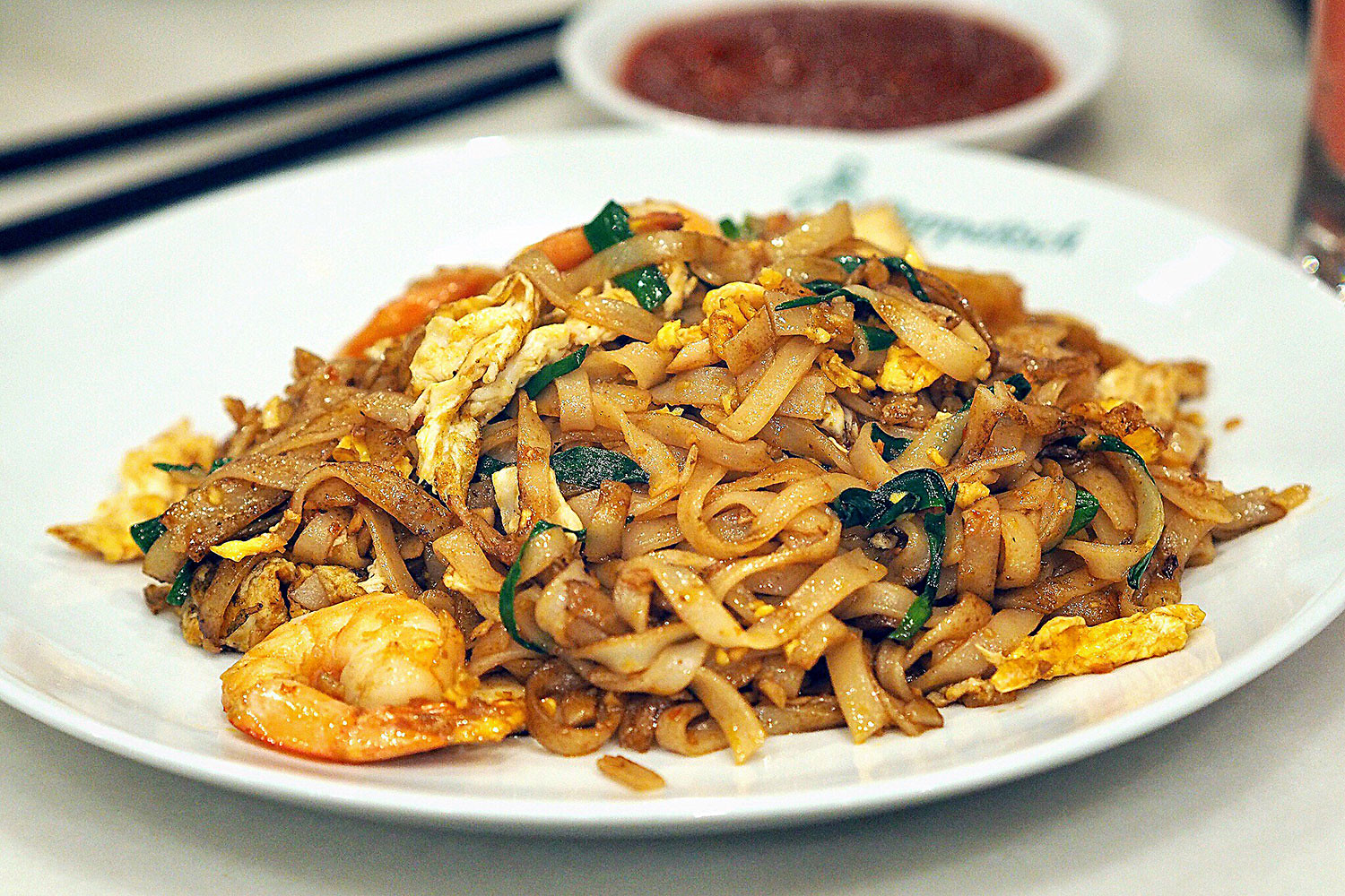 Malaysian char kway teow noodles with bean sprouts and egg