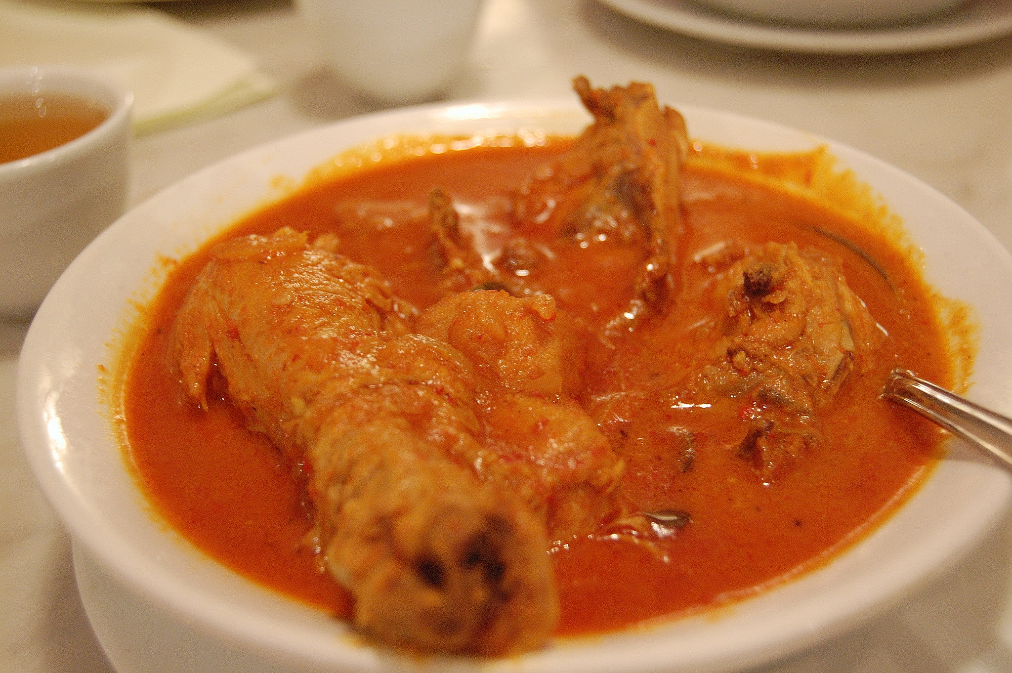 Kari kapitan Penang Nyonya chicken curry in a bowl.