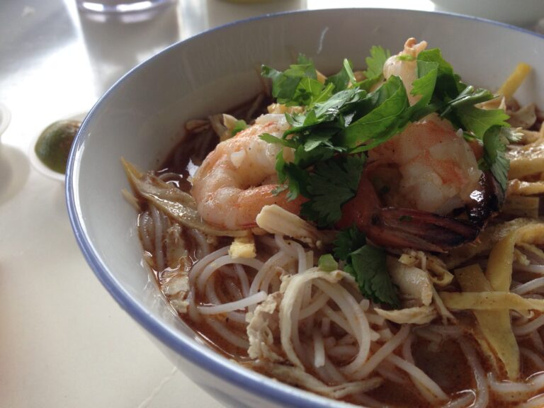 Malaysian noodle soup with chicken and shrimp, known as Sarawak laksa.