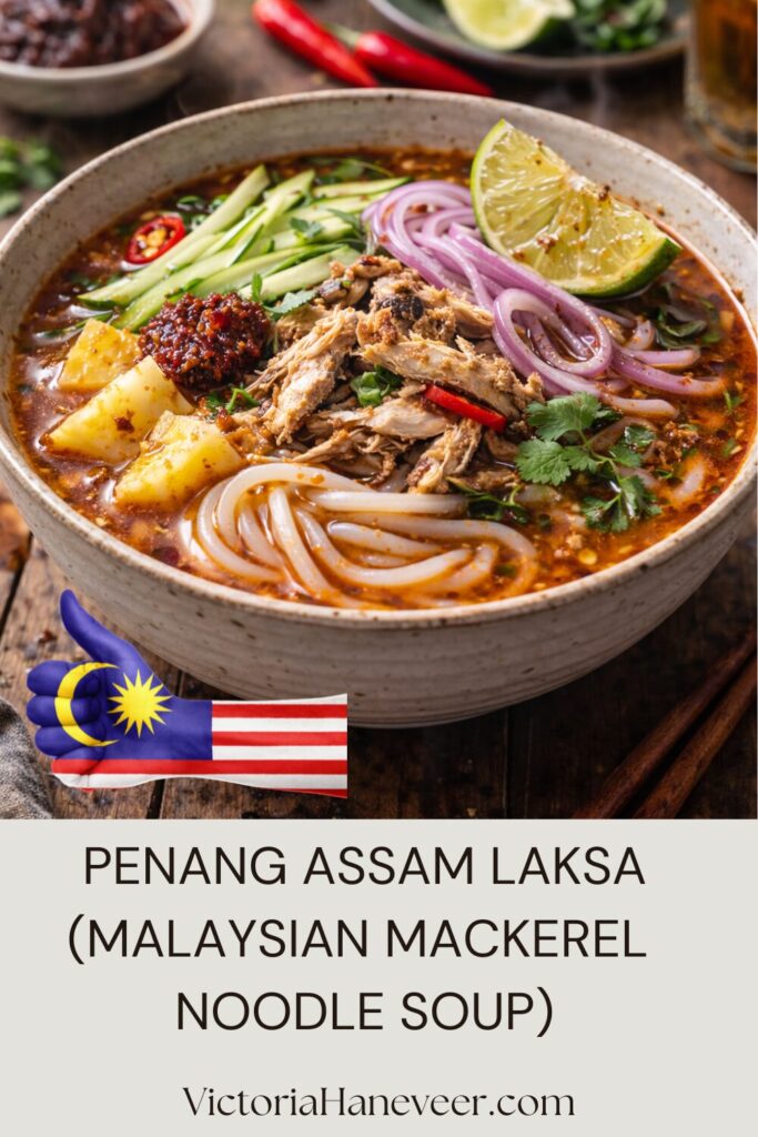 A bowl of prepared Penang assam laksa, a mackerel soup with noodles from Malaysia.