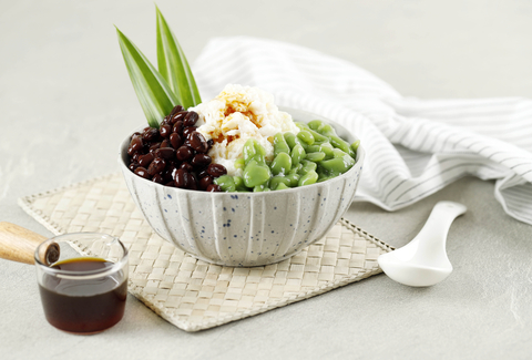 Malaysian cendol dessert with green pandan jelly over shaved ice.