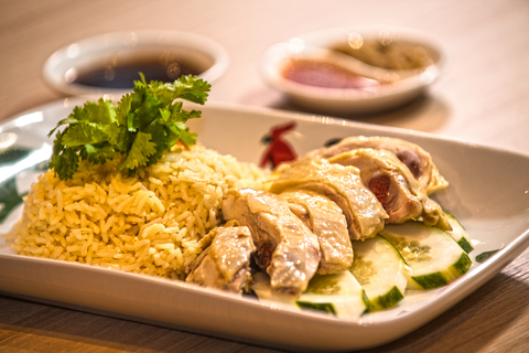 A platter of Hainanese chicken and rice, a Malaysian-Chinese dish.