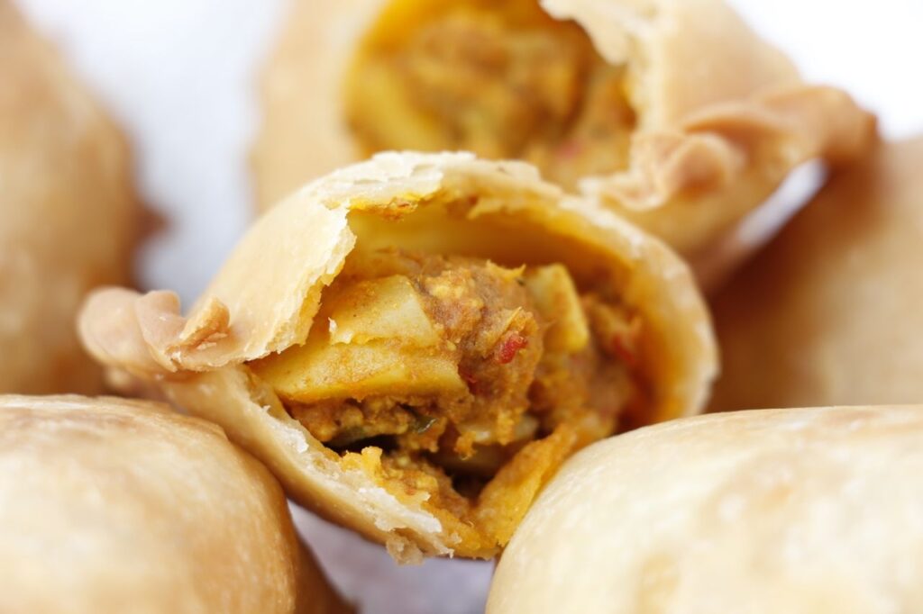 Close up of the interior of a Malaysian curry puff.