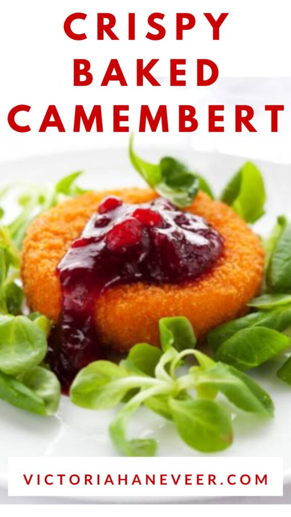 Baked camembert served with salad and cranberry sauce.