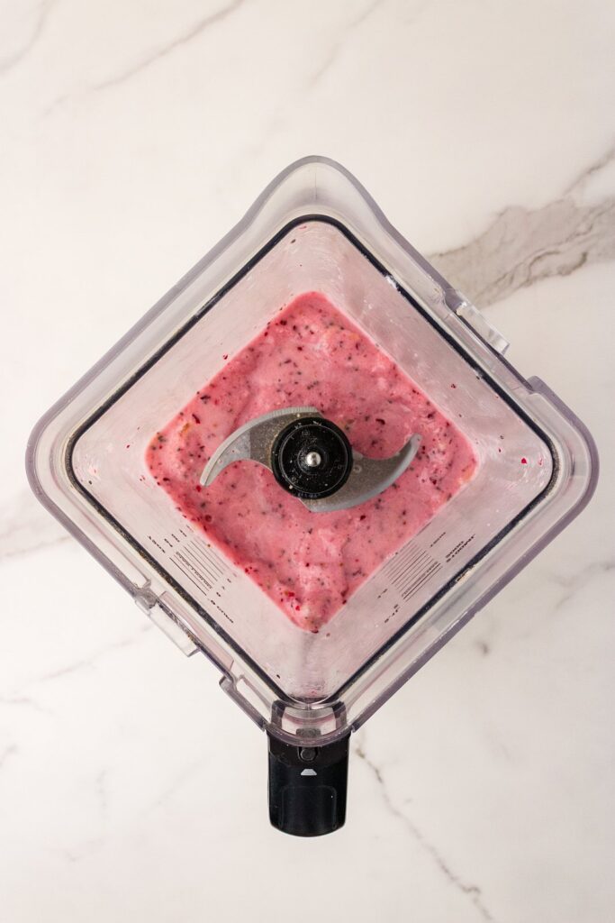 pink cranberry smoothie in a blender pitcher