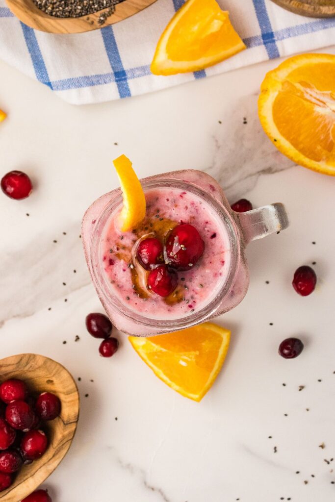 overhead cranberry smoothie with orange, cranberries and chia seeds
